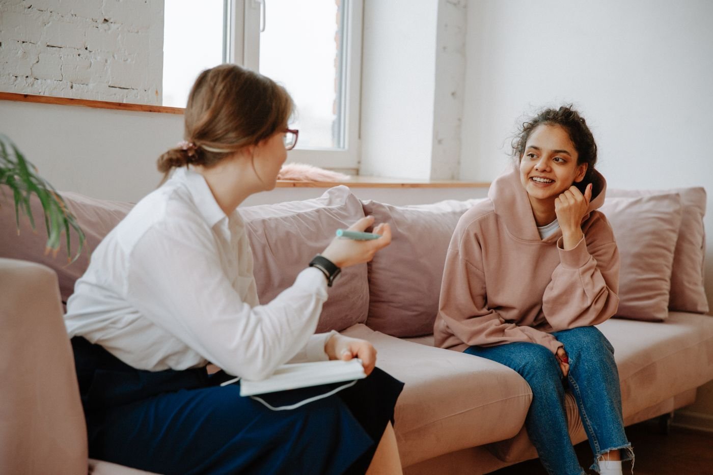 A client and therapist talking one on one