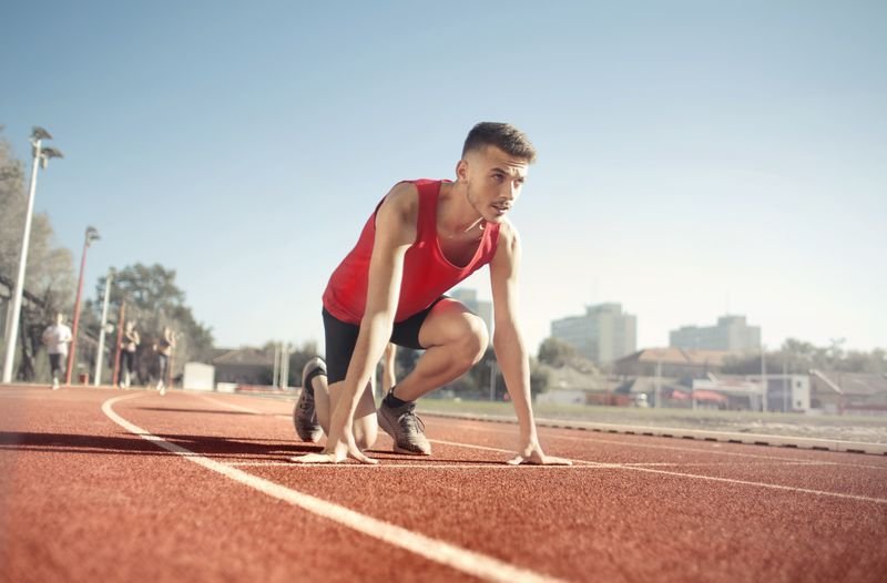 Runner in a starting position on a track